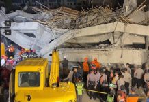 Rescuers run oxygen to survivors in Indonesia school building collapse that buried dozens 22